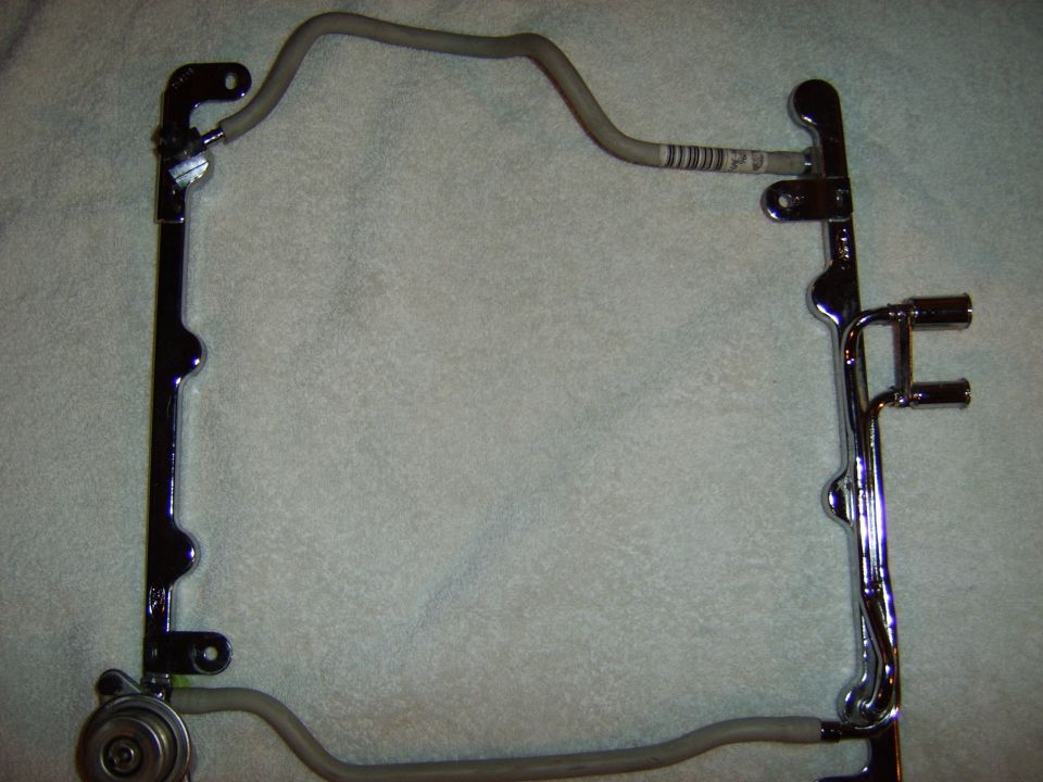 A new '96-'97 fuel rail - stock

Note the crossover lines which will have to be modified to clear the supercharger