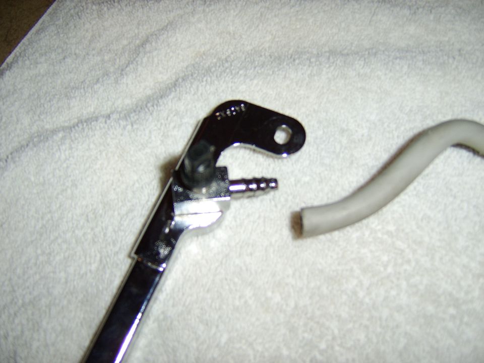 Cutting off the hoses (carefully) revealed the factory socketless hose barbs used for the fuel rail crossover tubes.

The factory tubes are actually plastic and coated with a rubber or vinyl like material.