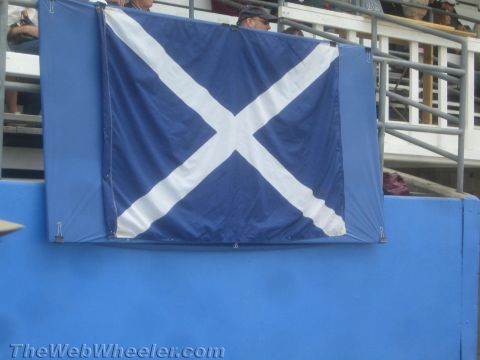 1968 Ford Mustang - Photograph of the Scottish saltire (St Andrew's Cross) flag draped on a stadium barrier.