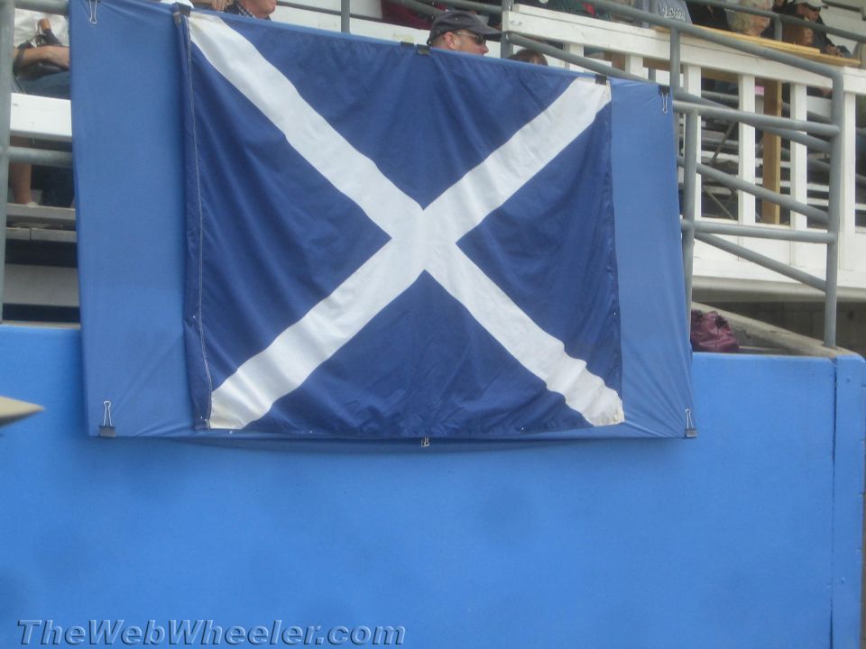 Scottish saltire flag hung on a grandstand barrier