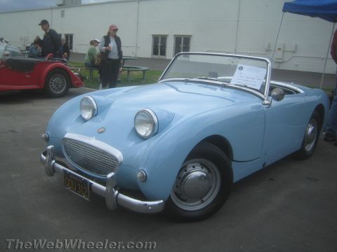 1968 Ford Mustang - Photo of a light blue Austin-Healey Bugeye Sprite at a car show, not a technical document.