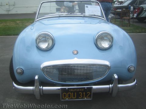 1968 Ford Mustang - Front-end photo of a light blue Austin-Healey Bugeye Sprite, not a technical document.