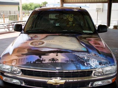 1995 Ford Crown Victoria - Custom painted SUV hood features a military theme with a map of Iraq, aircraft, and silhouettes of soldiers.