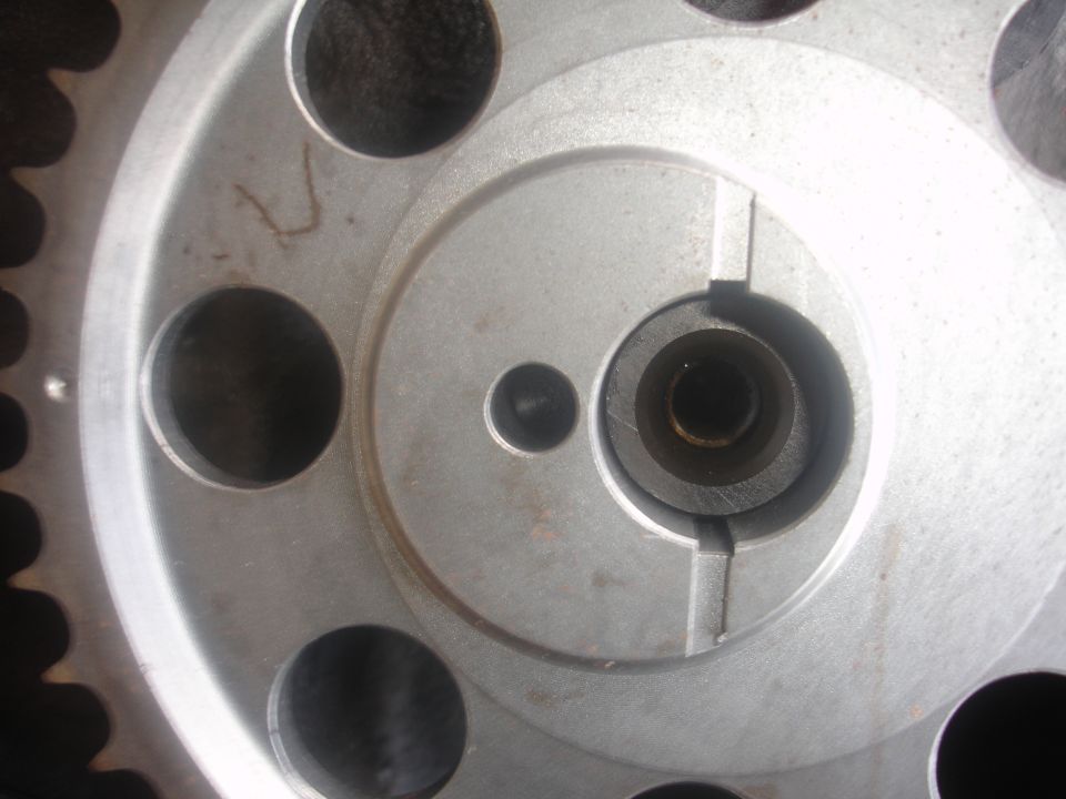 Close-up of an aluminum toothed gear hub showing keyway, dowel hole and lightening holes