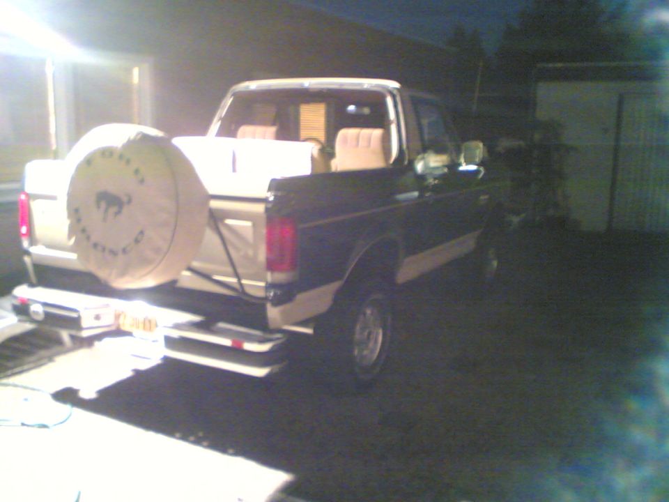 1988 Ford Bronco rear driver's side view with spare tire cover