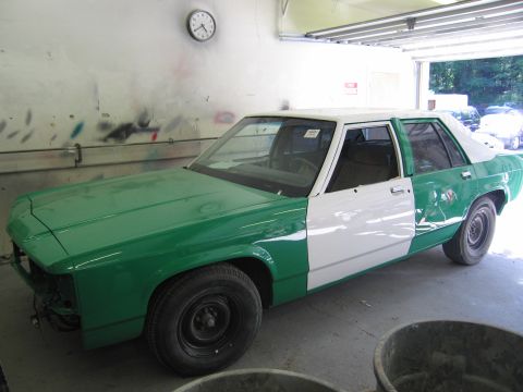 1991 Ford LTD Crown Victoria - Photo of a two-tone sedan during restoration, not a technical document.