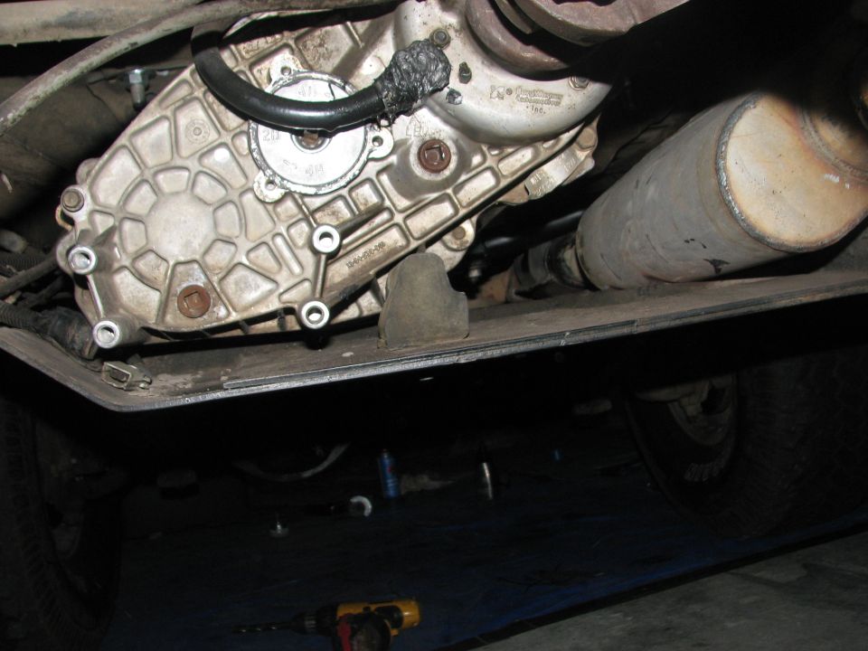 Underside view of a vehicle's transfer case and exhaust pipe