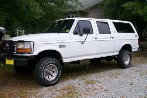 1992 Ford C-350 (Centurion Conversions) - White 1992 Ford C-350 Centurion Conversions SUV seen from the front-three-quarter angle.