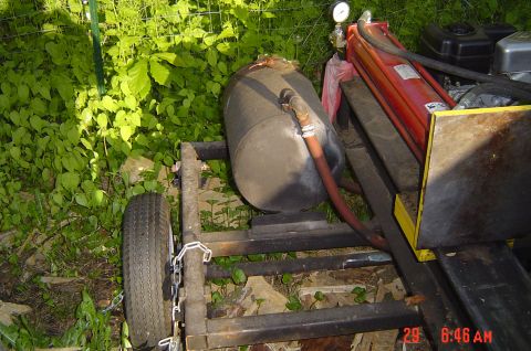1946 Ford F1 - This setup includes an air compressor tank and a hydraulic cylinder, likely for a splitter or similar equipment.