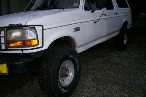 1992 Ford C-350 (Centurion Conversions) - This 1992 Ford C-350 Centurion Conversions SUV is shown from the front three-quarter angle.