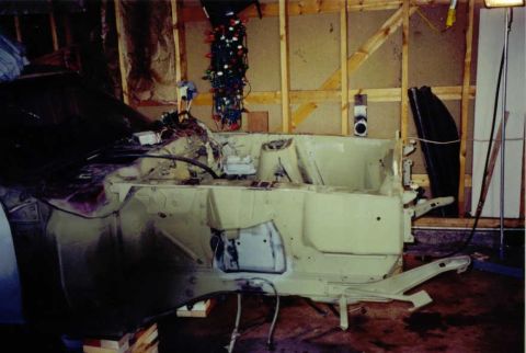 1969 Ford Mustang - The vehicle's chassis is visible, indicating it is in a state of restoration.