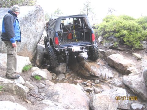 1994 Ford Bronco - A modified Ford Bronco tackles a challenging off-road obstacle course.