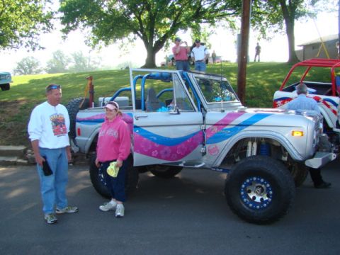 1994 Ford Bronco - A modified Ford Bronco is displayed with custom graphics and a roll cage.