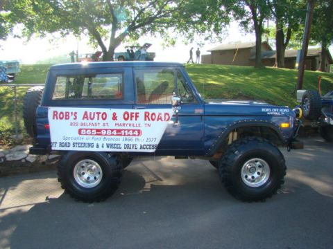 1994 Ford Bronco - This lifted blue Ford Bronco features a prominent banner for "ROB'S AUTO & OFF ROAD," highlighting their specialization in 1966-1977 Bronco…