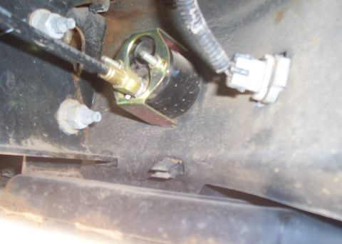 1994 Ford F-150 - Detail of a vehicle component, possibly related to brakes or suspension, with visible hardware and wiring.