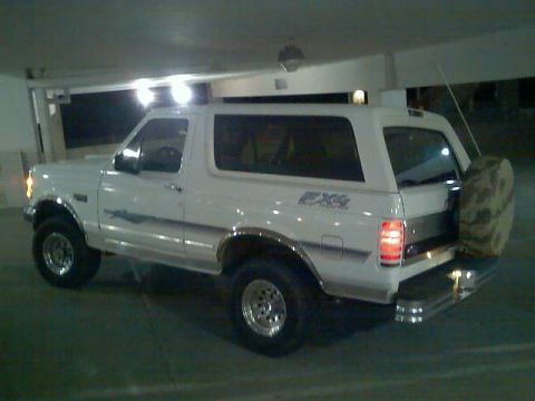 1996 Ford Bronco - This 1996 Ford Bronco is parked indoors, showing its rear quarter and spare tire.