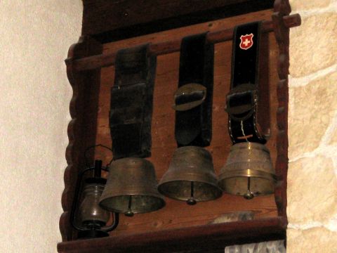 1996 Ford Bronco - Traditional Swiss cowbells and a lantern are displayed on a wooden shelf.