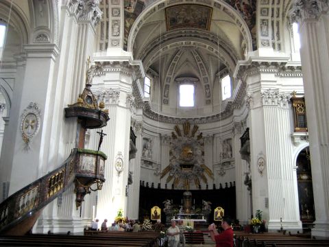 1996 Ford Bronco - The ornate interior of a large cathedral, a prominent pulpit and altar area with congregants seated.