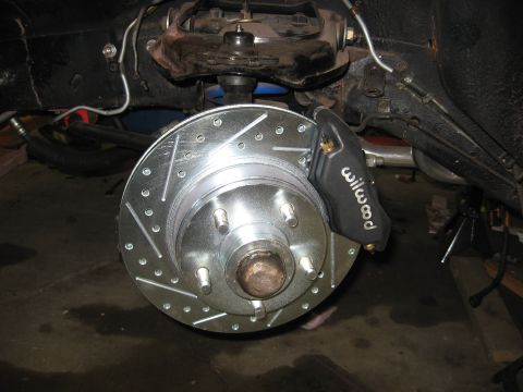 1978 Ford Mustang II - Close-up of a Wilwood brake caliper and a drilled brake rotor.