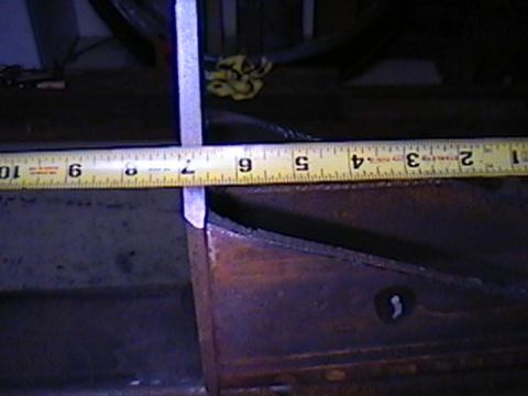 1992 Ford Bronco - A measuring tape is used to measure a metal frame.