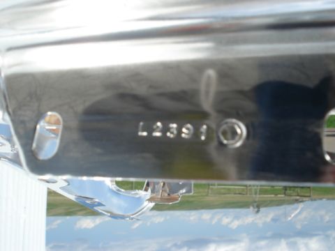 1979 Ford F-150 - Close-up of a chrome bumper part showing stamped identification numbers.