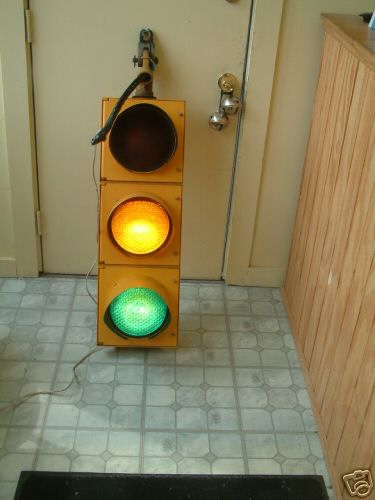 1993 Ford C-350 (Centurion Conversions) - Yellow traffic light with red, yellow, and green lenses is mounted on a door.