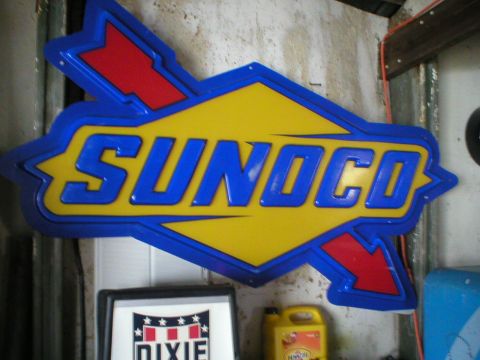 1993 Ford C-350 (Centurion Conversions) - A vintage Sunoco sign is displayed indoors, with other items visible in the background.