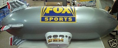 1993 Ford C-350 (Centurion Conversions) - Inflatable blimp with Fox Sports branding, likely a promotional item.