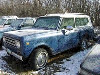 1992 Ford F-350 - International Harvester Scout II parked in a snowy lot with other vehicles.