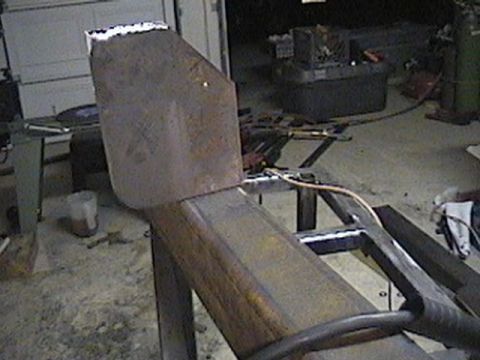 1992 Ford Bronco - A custom metal bumper section is being fabricated, with welding equipment visible in the background.