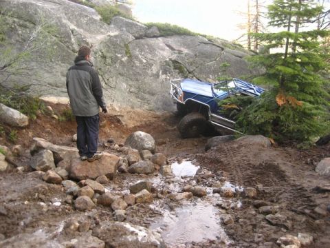 1989 Ford Bronco - Off-roading adventure: 1989 Ford Bronco navigates a challenging muddy terrain.