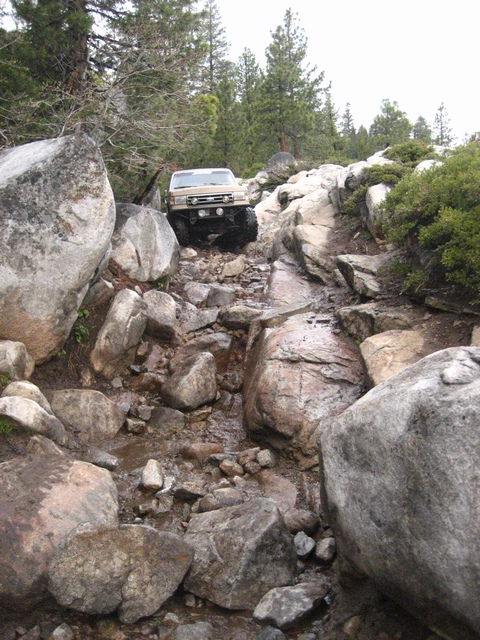 1989 Ford Bronco - This 1989 Ford Bronco is shown tackling a challenging rocky off-road path.