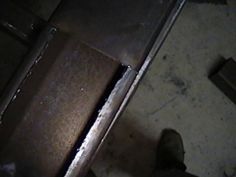 1992 Ford Bronco - Close-up of metal fabrication work, showing welds and surface rust.