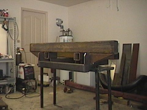 1992 Ford Bronco - Custom steel bumper fabrication in progress, with welding equipment visible in the background.