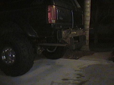 1992 Ford Bronco - The rear of a 1992 Ford Bronco shows a custom-fabricated bumper and a red taillight.