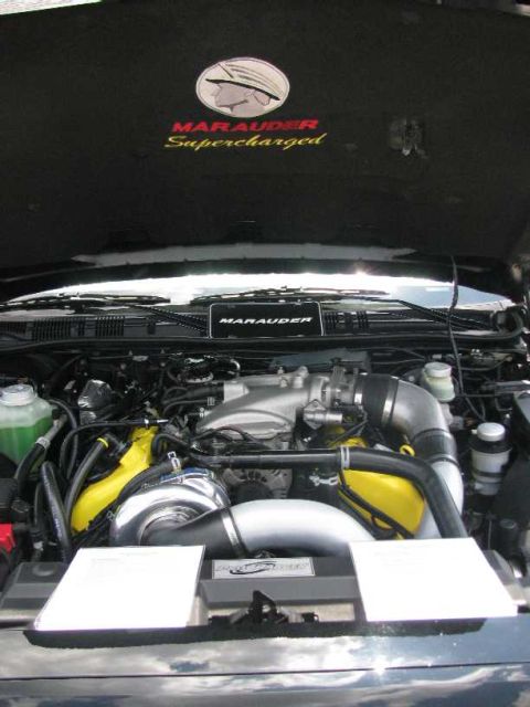 2003 Mercury Marauder - Engine bay details with 'Marauder Supercharged' text and a 'Marauder' badge visible.
