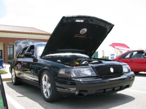 2003 Mercury Marauder - A black 2003 Mercury Marauder is displayed with its hood open, revealing the engine bay.