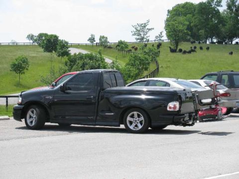 2003 Mercury Marauder - This Lightning was driven by an 80 year old-appearing woman on the scooter attached to the rear.