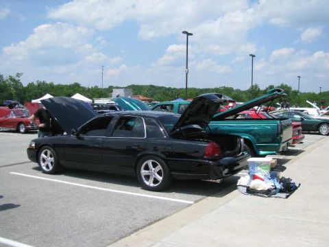 2003 Mercury Marauder - Black 2003 Mercury Marauder on display at a car show with its hood and trunk open.