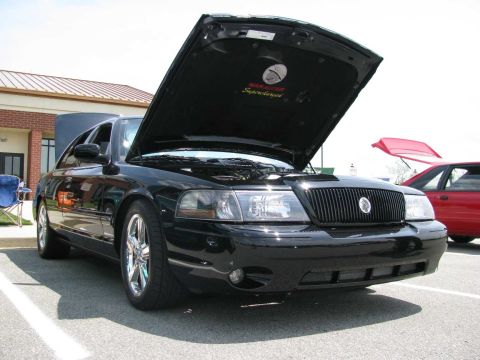 2003 Mercury Marauder - Black 2003 Mercury Marauder at a car show, hood open. Another car is visible in the background.