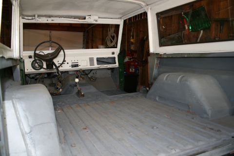 1974 Ford Bronco - The interior of a 1974 Ford Bronco is shown, stripped down and ready for restoration work.