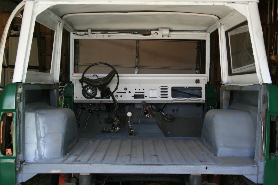 1974 Ford Bronco interior, showing dashboard, steering wheel, and empty cargo area