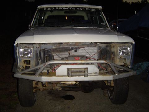 1979 Ford Bronco - This 1979 Ford Bronco features a custom front bumper and winch, with visible "2 BIG BRONCOS 4X4 CLUB" text on the windshield banner.