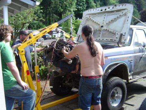 1979 Ford Bronco - Engine removal in progress on a 1979 Ford F-Series truck using an engine hoist.