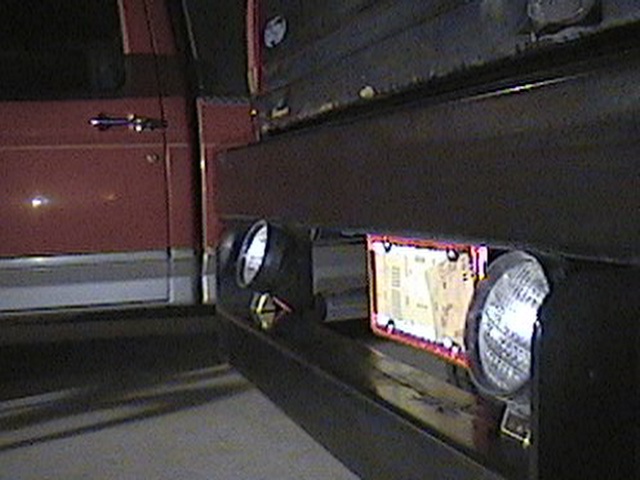 Rear bumper with license plate and taillights