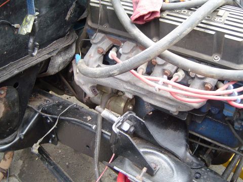 1979 Ford Bronco - Ford V8 engine components including starter motor and exhaust manifold are visible in this close-up shot.