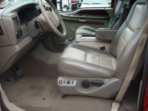 2003 Ford Excursion - Interior view of a 2003 Ford Excursion, highlighting the driver's seat and dashboard.