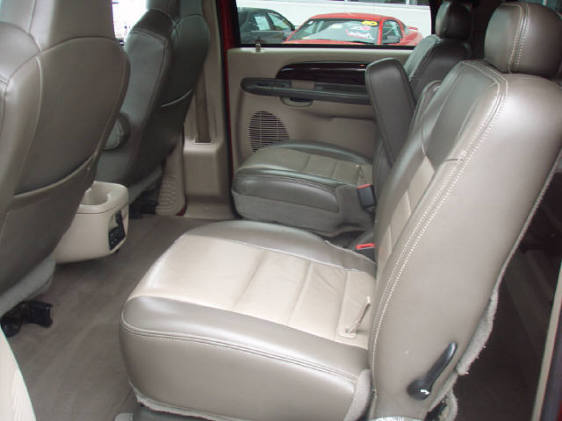 Interior shot of a large SUV's leather seats and center console