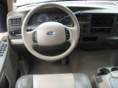 2003 Ford Excursion - Interior view of a 2003 Ford Excursion, highlighting the dashboard, steering wheel, and center console.