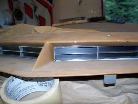 1971 Ford Ranchero - A close-up view of a vehicle's dashboard vent, taped off for installation or repair.